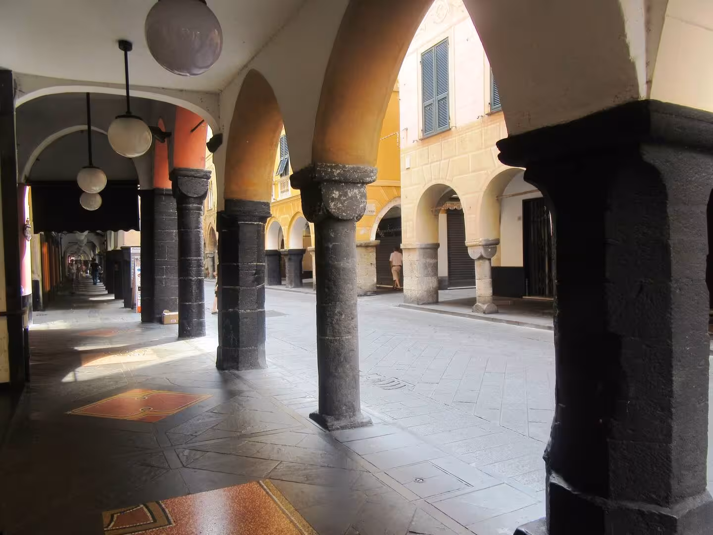 Charming arched walkway with atmospheric lighting for exclusive private dining experience.