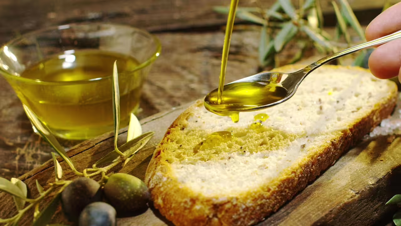 Extra virgin olive oil drizzled on Tuscan bread at Frantoio Buonamici, Fiesole truffle experience