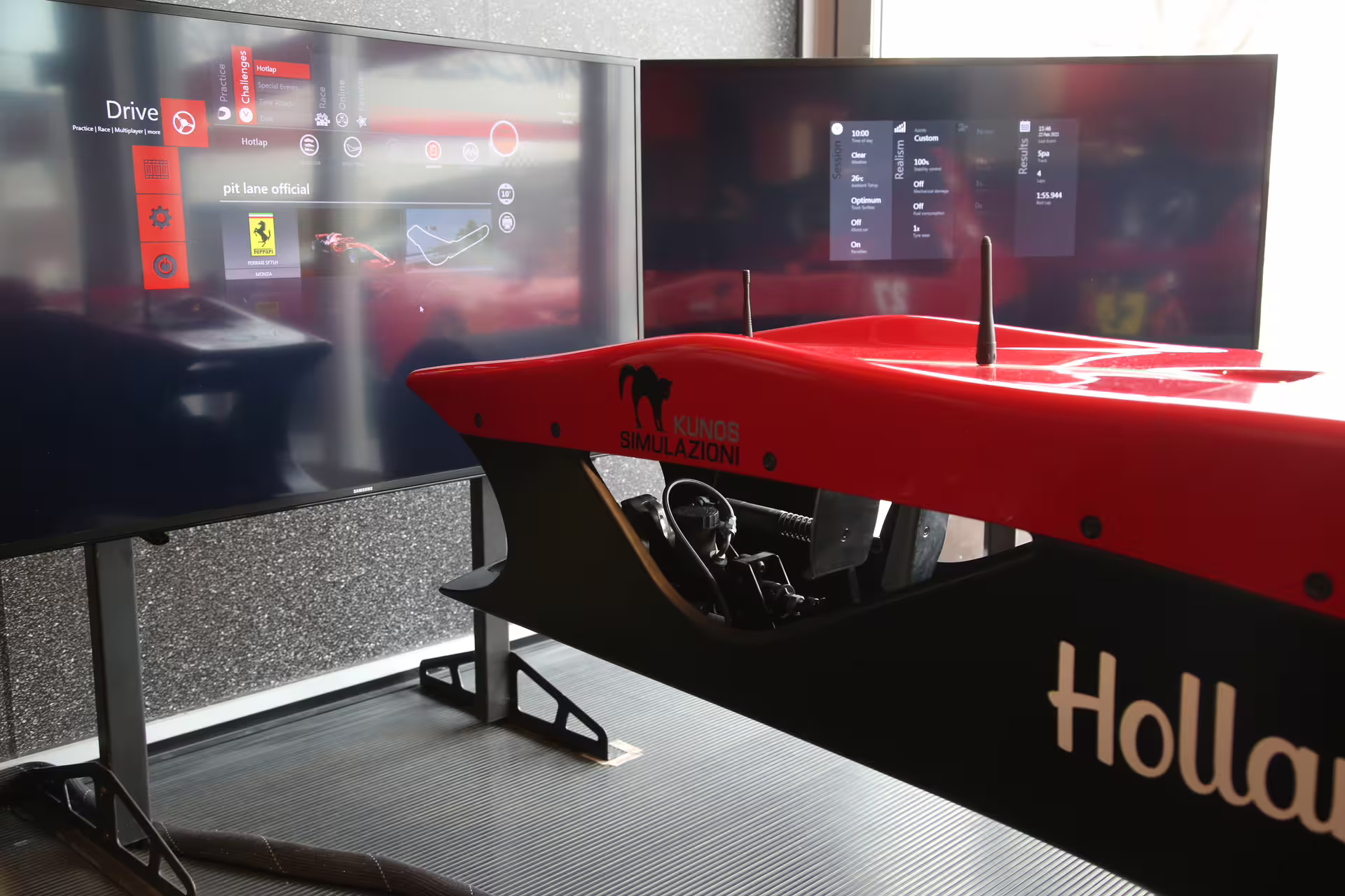 F1 simulator setup with dual screens displaying racing data at Museo Ferrari Maranello for an immersive driving experience.
