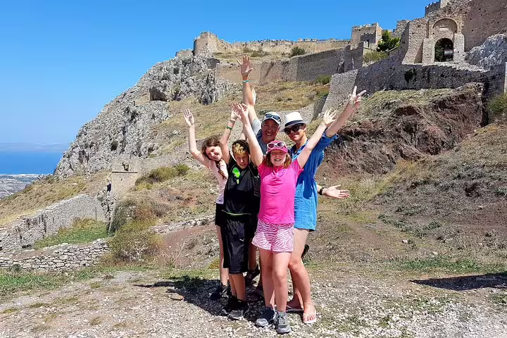 Family posing at Acrocorinth fortress near Corinth, part of a private Athens day tour to Peloponnese highlights