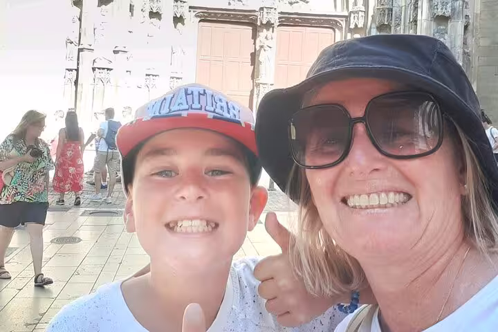 Family selfie near Aix-en-Provence historic square during a self-guided scavenger hunt and sights tour