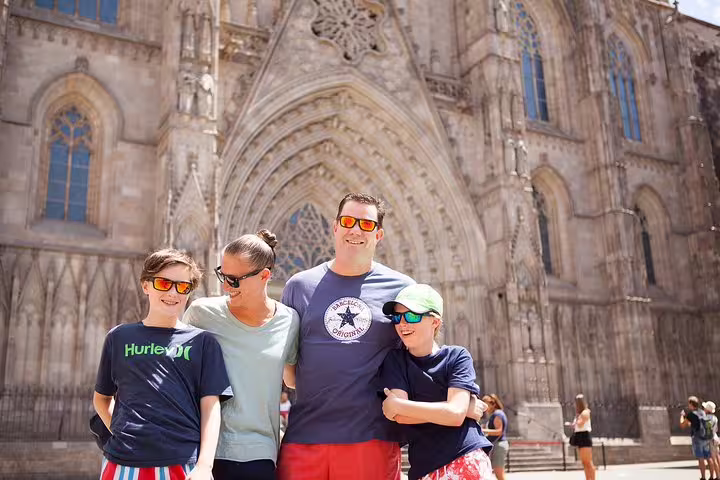 Family posing at Barcelona Cathedral on a secret corners photoshoot tour in the Gothic Quarter