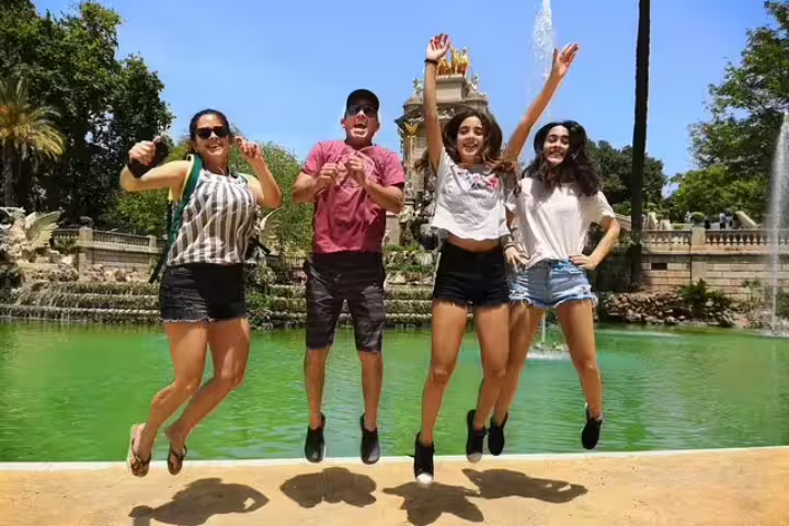 Family enjoying a fun-filled day at a Barcelona park, perfect for a private tour with churros, hot chocolate, and games.