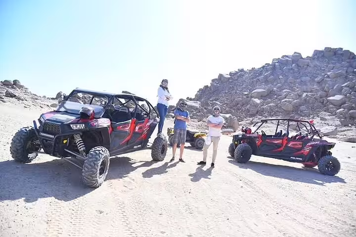 Family buggy adventure from Sharm El Sheikh with off-road buggies parked in Sinai desert mountains