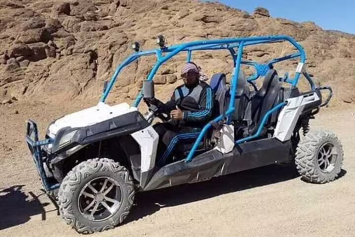 Four-seat off-road buggy parked in Sinai mountains, family desert safari tour pickup from Sharm El Sheikh