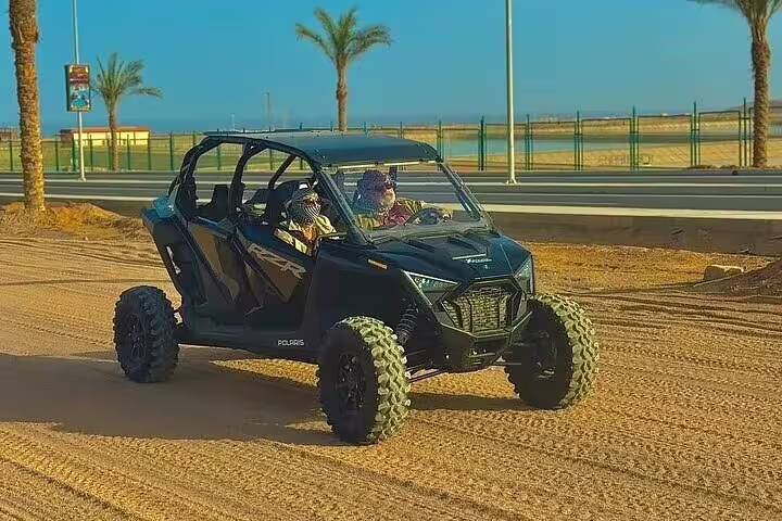 Family buggy ride on desert track near Sharm El Sheikh, Red Sea coast, guided safari adventure tour