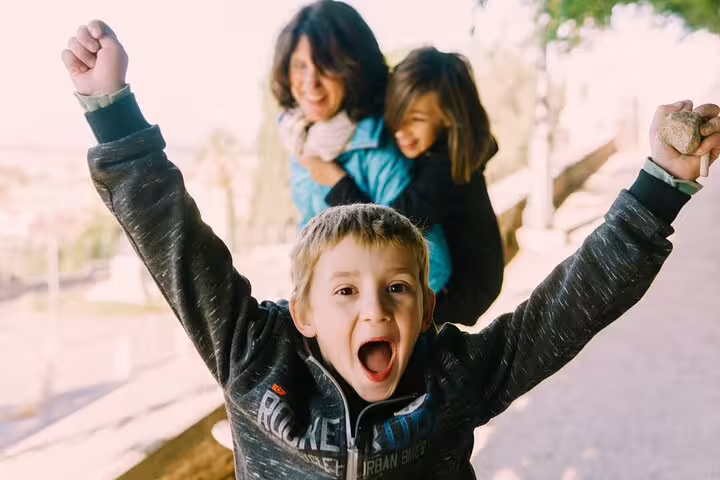 Family candid moment in Rome, kids playing during a private 3-hour personal travel photographer photo session