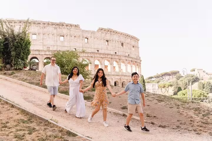 Family walking by the Colosseum in Rome on a private 3-hour personal photoshoot with local photographer