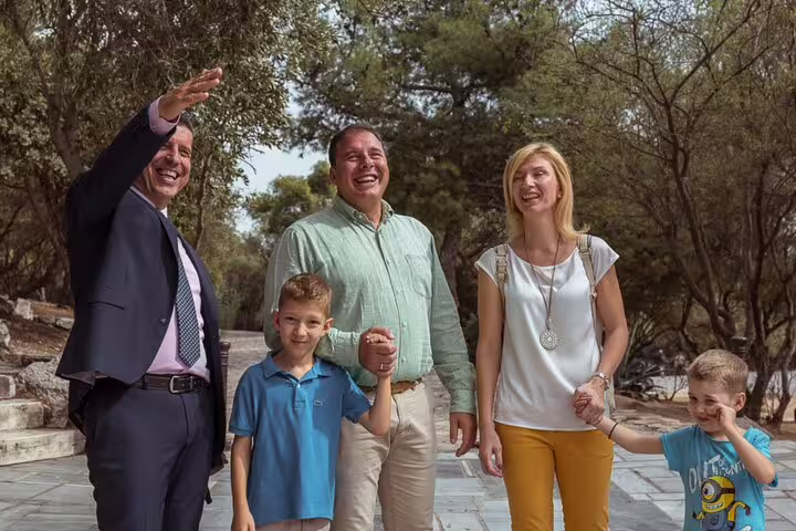 Family with guide enjoying a scenic stop on a day trip from London to Cotswolds villages, England
