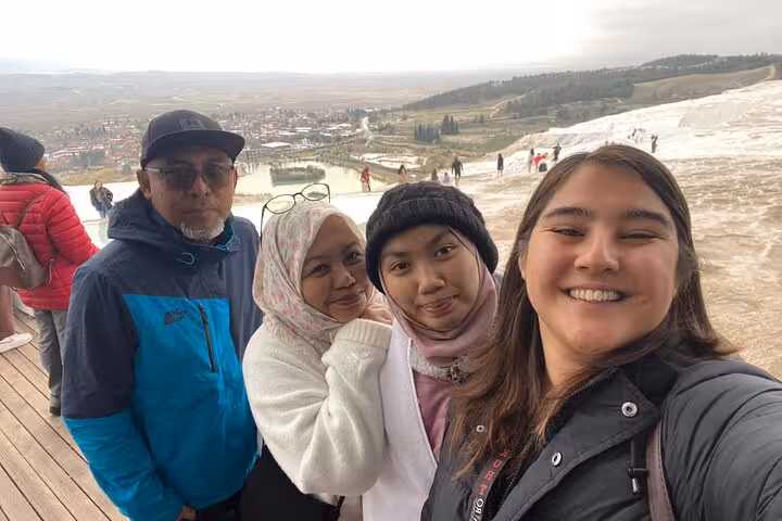 Family selfie at Pamukkale white travertines viewpoint on a private Denizli Airport to Pamukkale tour