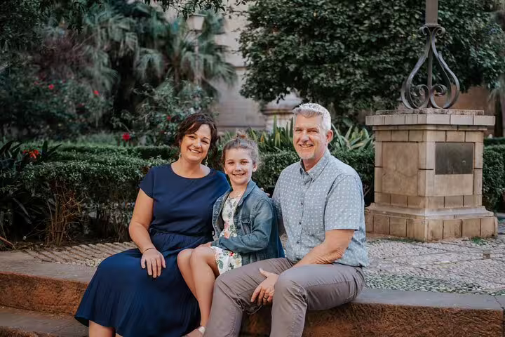 Family enjoying a private photoshoot in a lush garden setting in Marbella, perfect for capturing memorable moments.