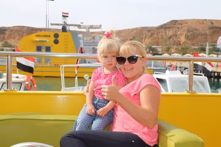 Family on Royal Seascope semi submarine deck in Sharm El Sheikh marina before Red Sea underwater tour