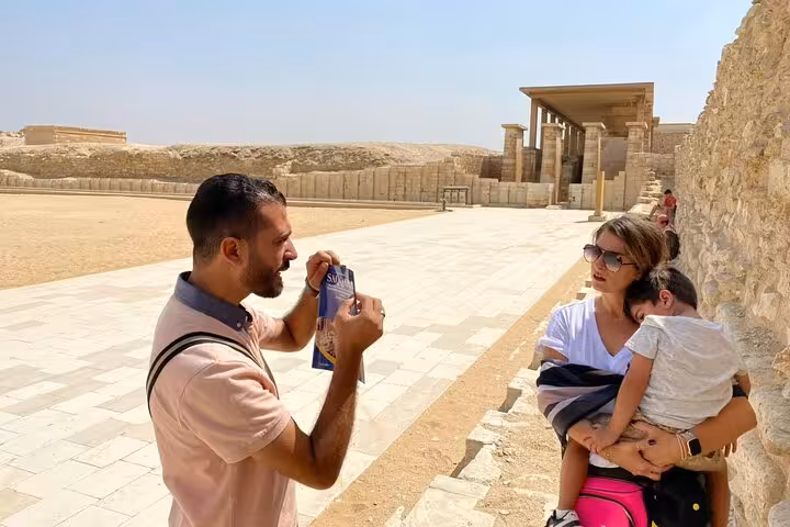 Guide photographing family at Saqqara Step Pyramid complex during private Giza Pyramids, Memphis day tour