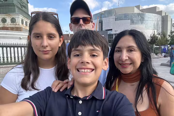 Family selfie at Place de la Bastille during a Paris Marais District scavenger hunt and self-guided walking tour