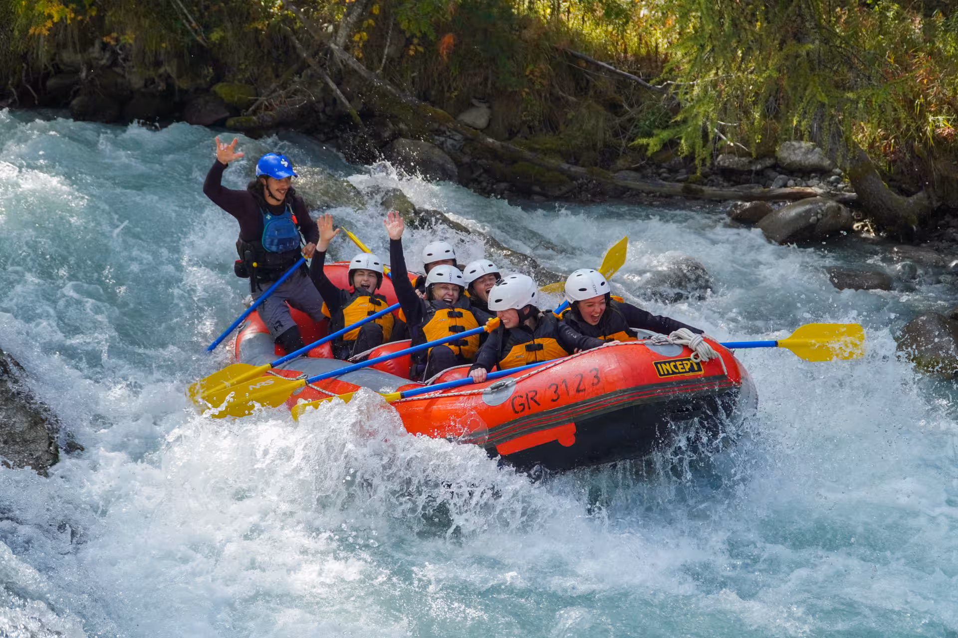 Family enjoying thrilling white-water rafting adventure on Engadin river with skilled guide.