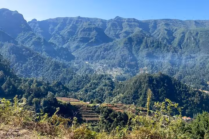 Panoramic West Madeira valley and rugged peaks seen on Fanal Forest skywalk and lava pools 4x4 tour