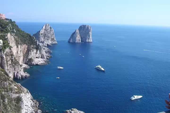 Faraglioni sea stacks view from Capri cliffs, included ferry tickets on Naples to Capri and Anacapri small group tour