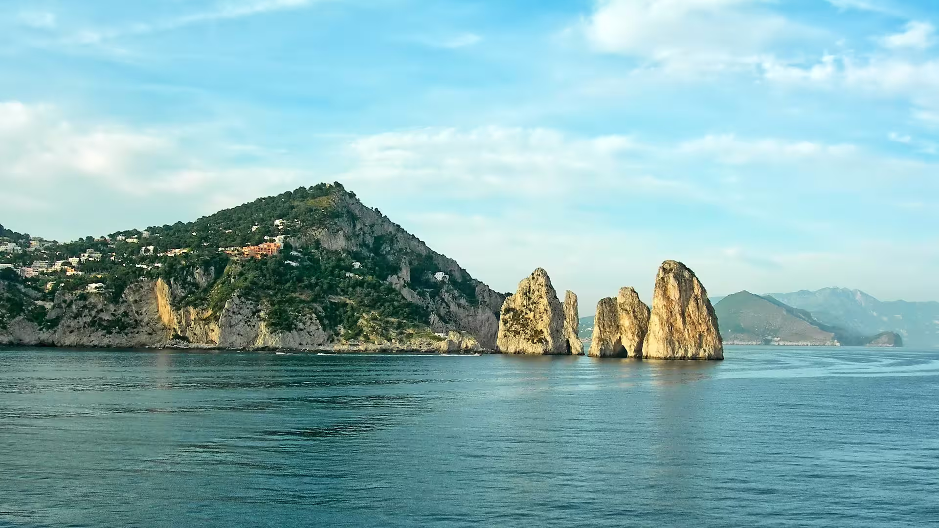 Faraglioni sea stacks off Capri island on an 8-day Italy of the Emperors tour from Rome to the Amalfi Coast