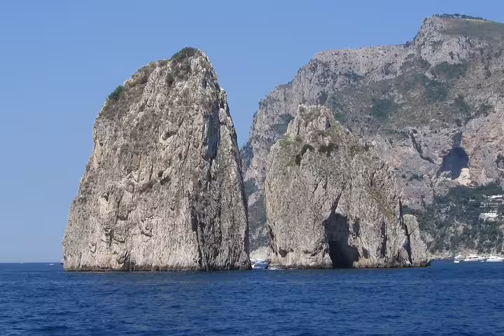 Faraglioni rocks off Capri coast on small group Naples to Capri and Anacapri ferry day trip