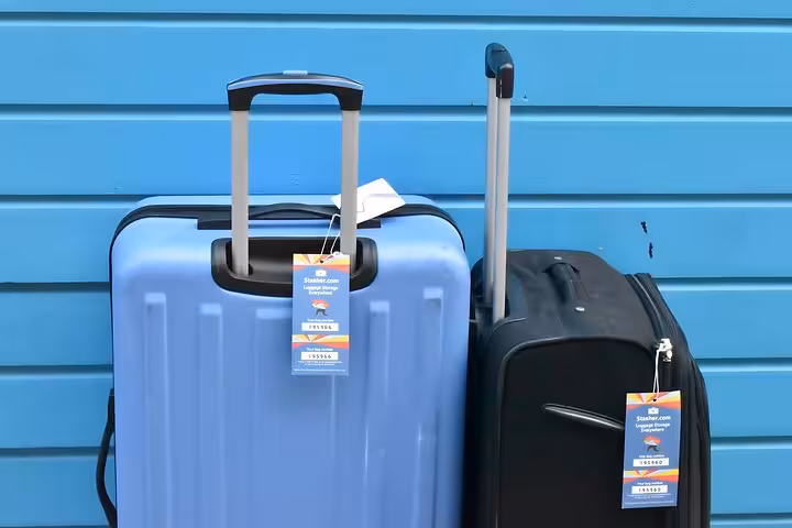 Suitcases with Stasher tags ready for secure luggage storage in Faro, ideal for airport and city center travelers