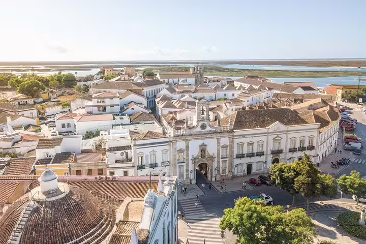 Aerial view of Faro old town rooftops and lagoon, starting point for Faro to Sagres private coastal journey
