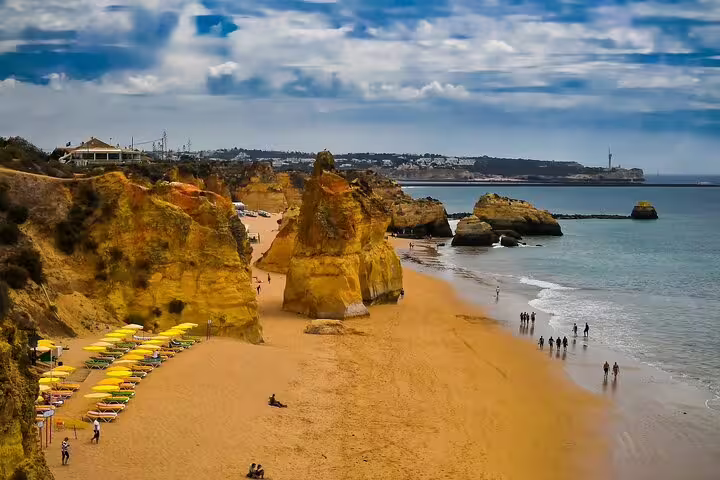Golden cliffs and sandy Praia da Rocha beach, Algarve coastal scenery on Faro to Sagres private tour