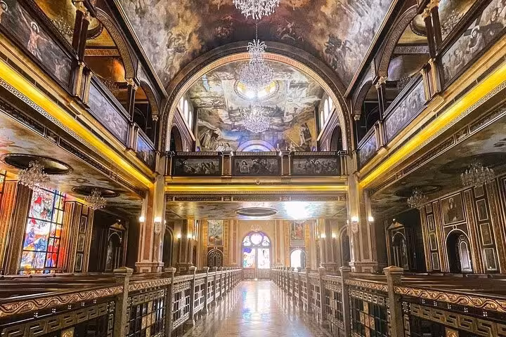 Ornate interior hall with chandeliers and murals visited on Sharm El Sheikh guided city sightseeing tour