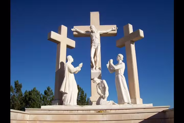 Statue of Crucifixion Scene in Fatima, Portugal - Private Tour of Fatima, Nazareth and Óbidos - Religious and Historical Landmarks Tour