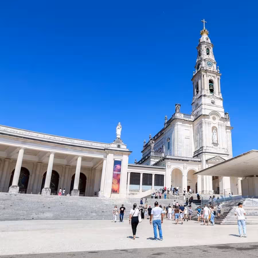 Pilgrims at Fátima Sanctuary, Basilica of Our Lady of the Rosary on a sunny day tour from Lisbon
