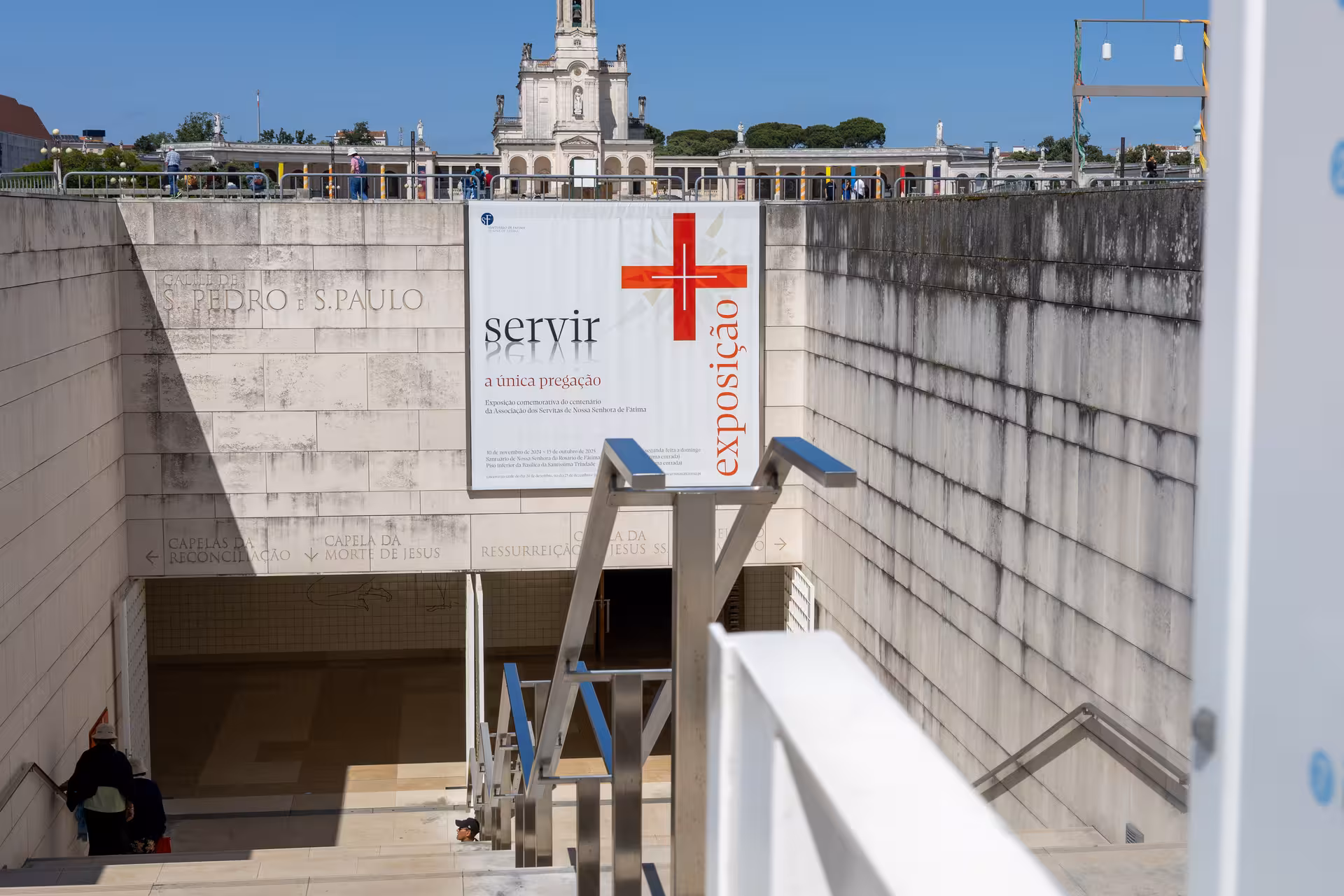 Entrance to the Fátima Sanctuary with a prominent exhibition sign, highlighting a spiritual stop on the Lisbon tour.