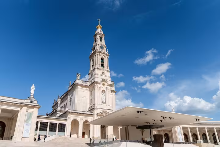 View of the iconic Fátima Sanctuary under a clear blue sky, a highlight of the Private Sintra Tour from Lisbon.
