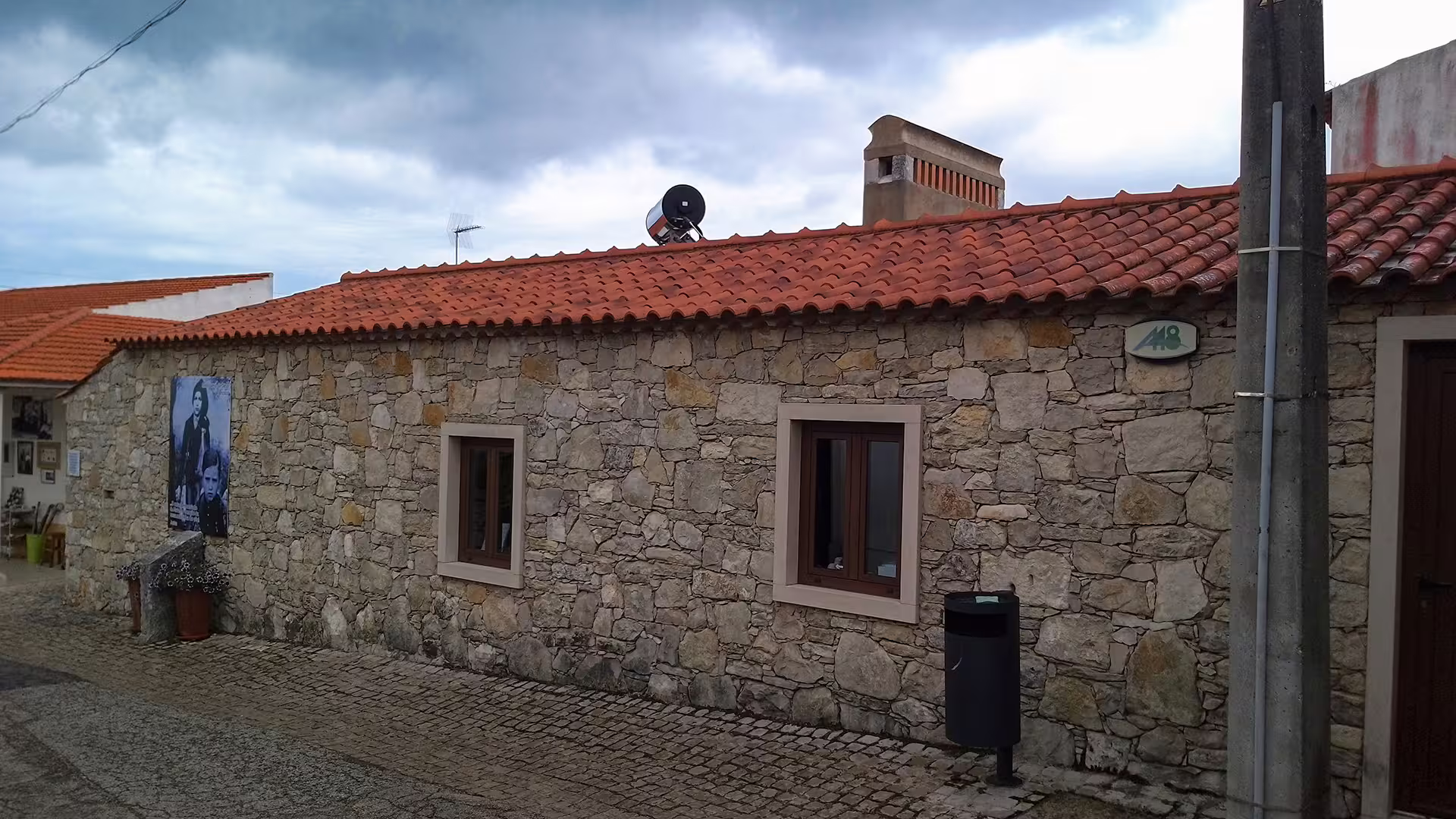 Stone house with red-tiled roof in Fátima, Portugal, showcasing the historic charm of the Little Shepherds' homes.