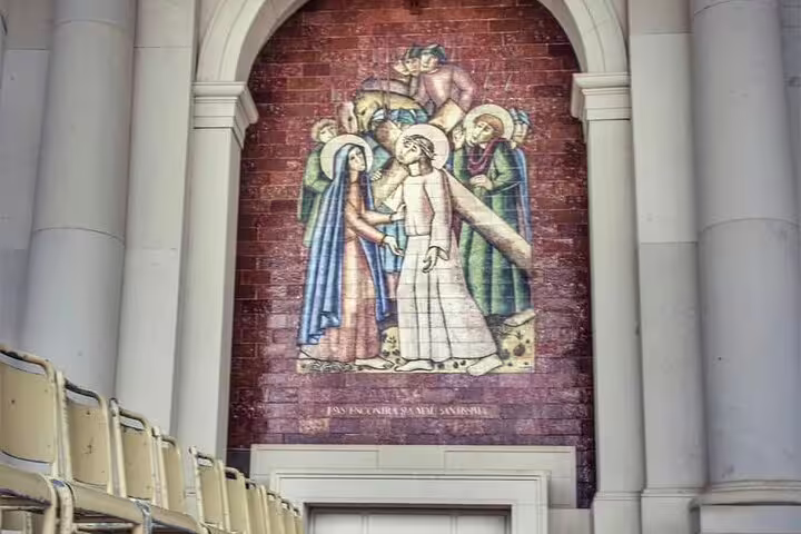 Mosaic artwork inside Fátima Sanctuary depicting a biblical scene, featured in the Fátima day trip from Lisbon for small groups.