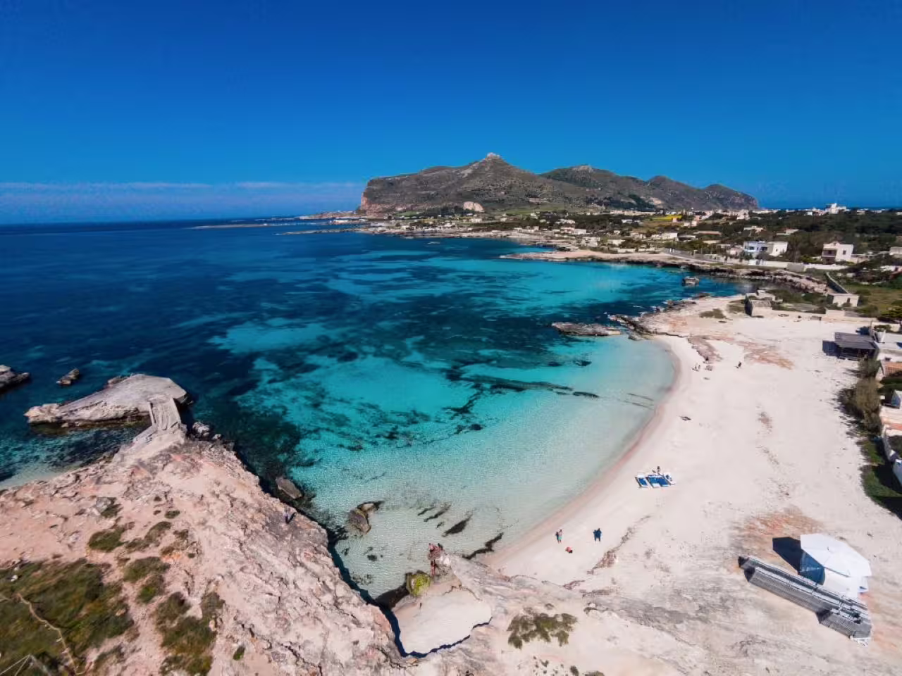 Aerial view of Favignana beach and turquoise bay, Egadi Shuttle Tour stop between Favignana and Levanzo
