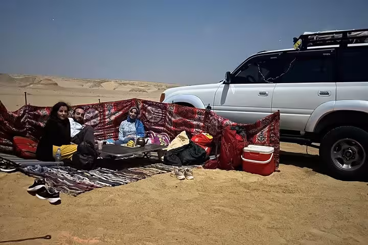 4x4 desert camp setup in Fayoum Oasis near Magic Lake, Wadi El Hitan day trip with local picnic