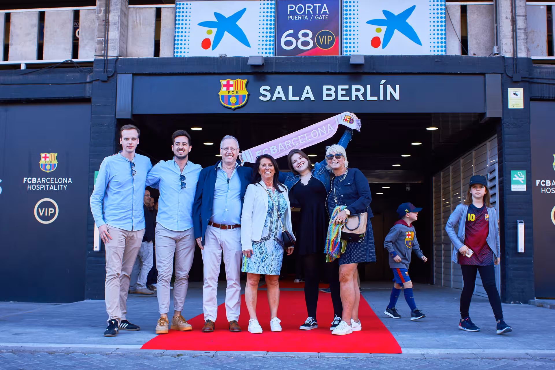 FC Barcelona matchday VIP entrance at Sala Berlín, fans with Barça scarf on red carpet experience
