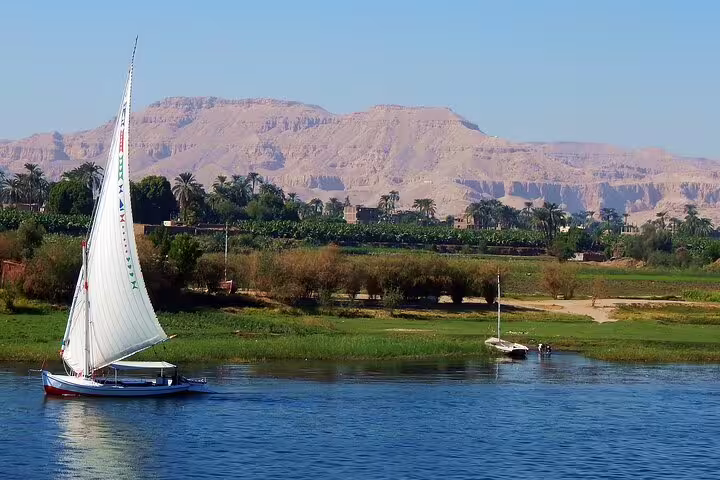Felucca sailing on the Nile in Aswan, scenic view on private day tour to High Dam, Philae and Obelisk