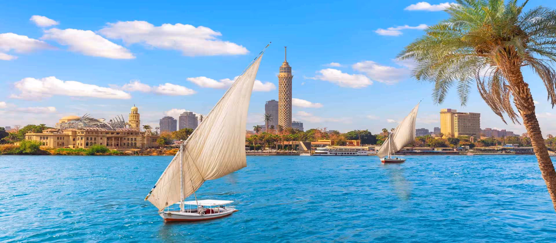 Felucca sailboats on the Nile in Cairo, scenic river cruise moment on the 10-day Egypt adventure itinerary