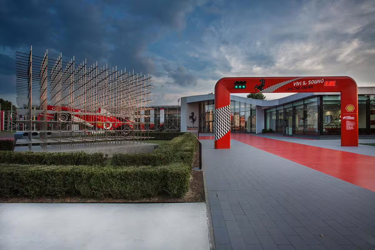 Entrance to the Ferrari Museum in Maranello with iconic red arch, perfect for prebooked tickets and tours