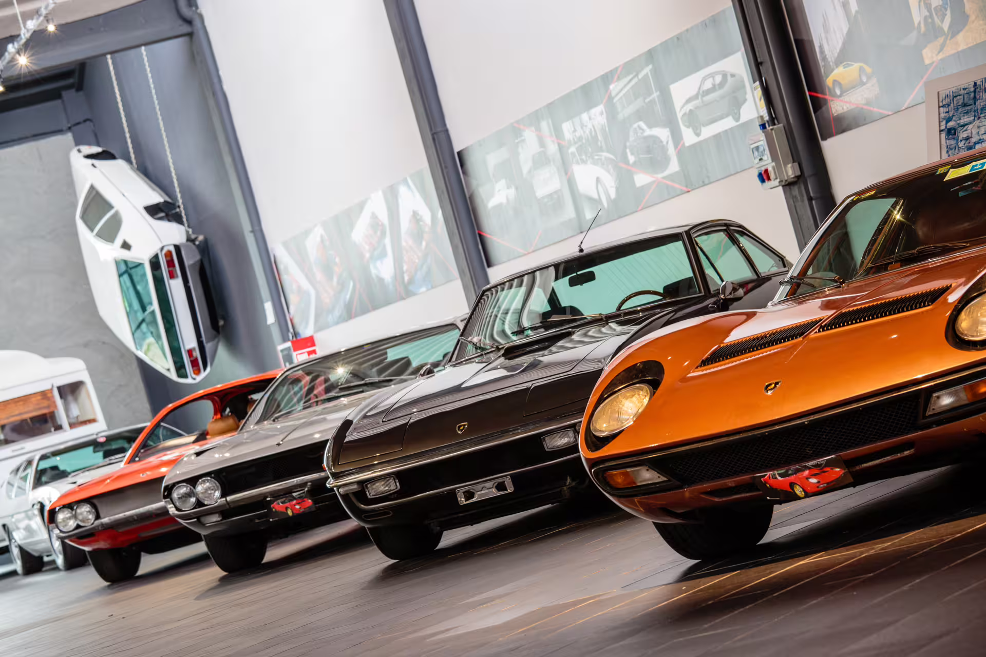 Row of vintage Lamborghini models in the Ferruccio Lamborghini Museum near Bologna, included with entry ticket