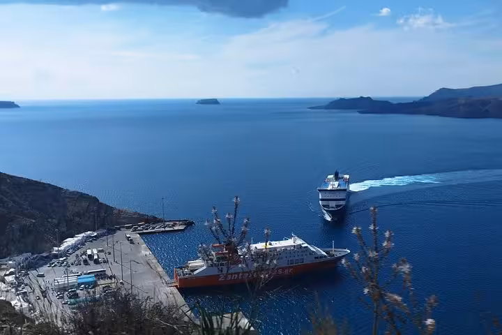 Ferry arriving in Santorini caldera harbor, scenic Aegean crossing on private day trip from Crete