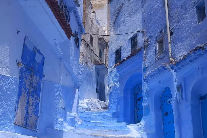 Discover Chefchaouen's iconic blue-painted steps and charming architecture on a guided tour from Fez.