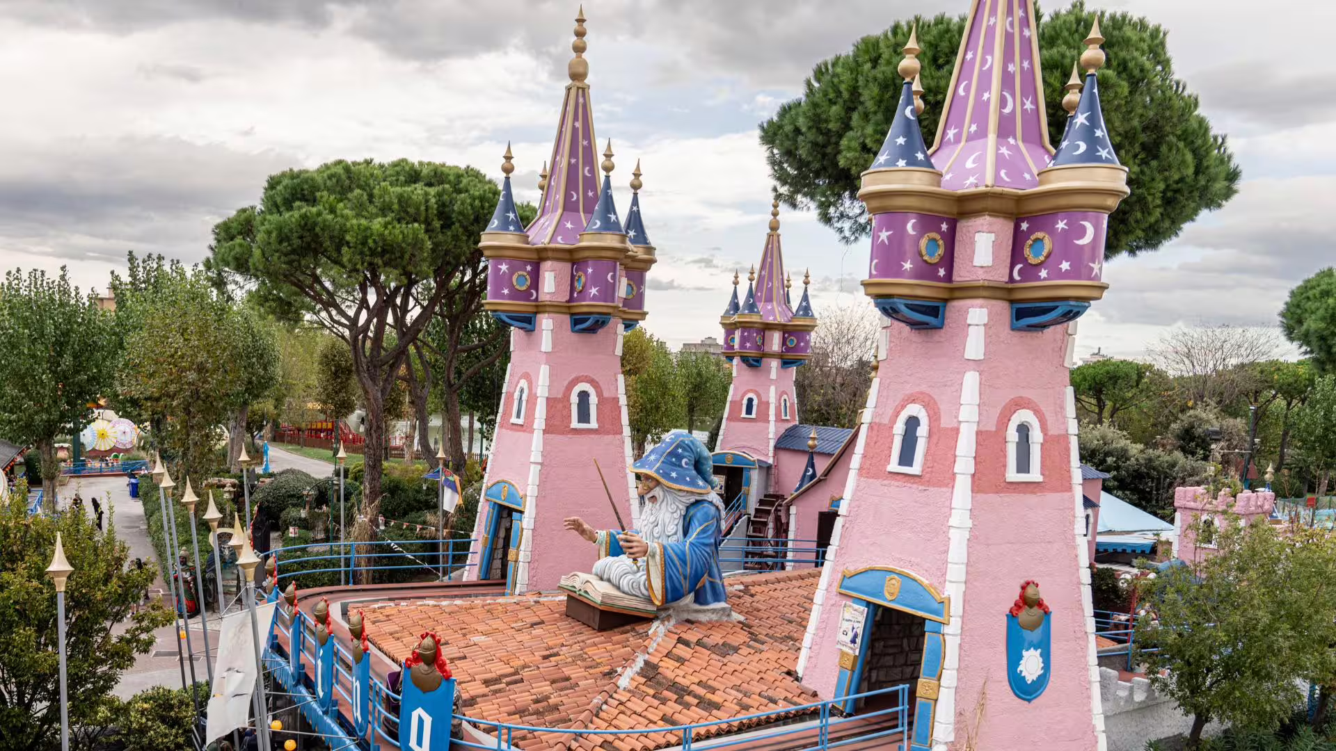 Fairytale castle towers at Fiabilandia Rimini, family amusement park entrance ticket attraction area