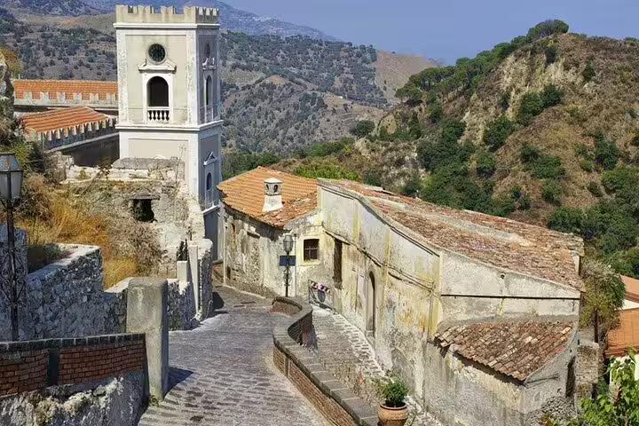 Ficuzza village lane with old church tower and mountain scenery on Sicilian Mafia history tour from Palermo