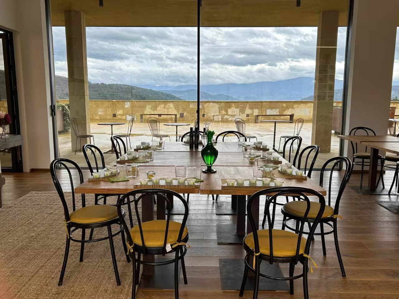 Tuscan EVO olive oil tasting setup at Frantoio Buonamici in Fiesole with panoramic terrace views