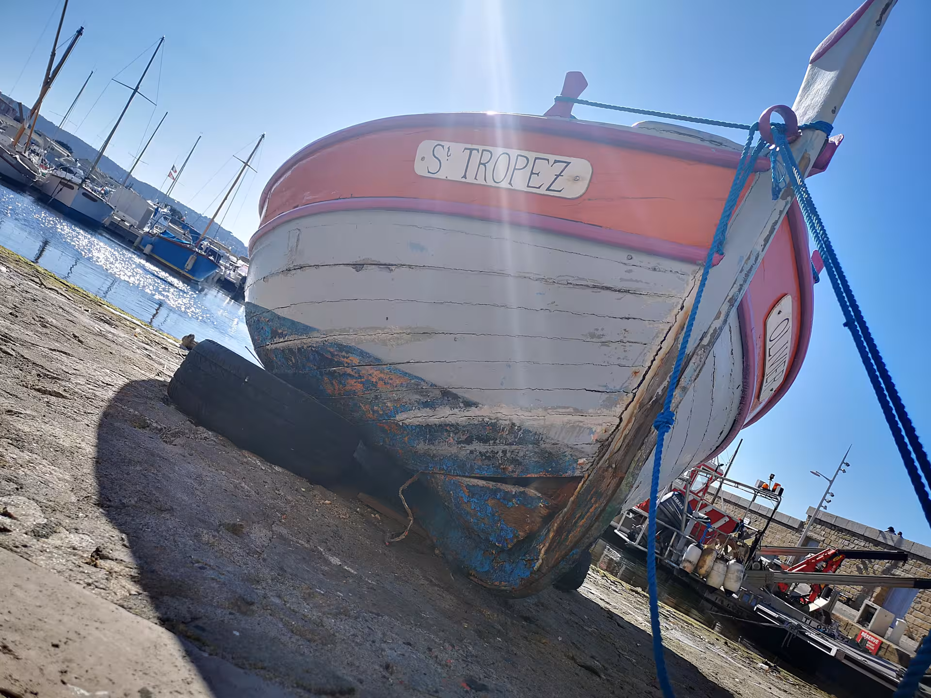 Colorful fishing boat in Saint-Tropez harbor, classic Riviera scene on a private Hyères and Le Lavandou tour
