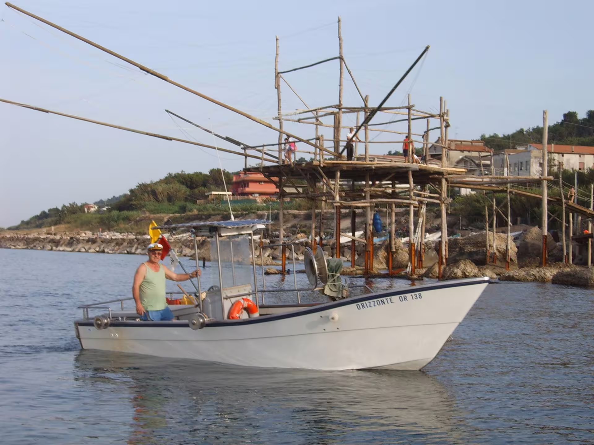 Fishing boat near a traditional trabocco on Italy’s Trabocchi Coast, Abruzzo fishing tourism tour experience