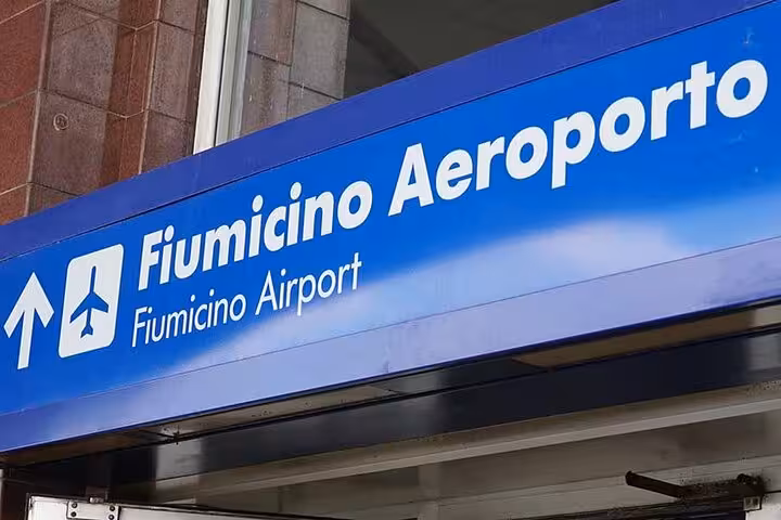Entrance sign for Fiumicino Airport in Rome, ideal for convenient airport transfer services.