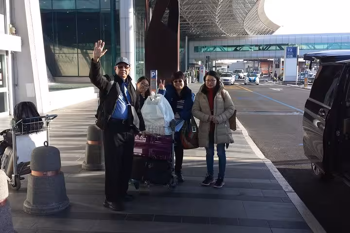 Passengers with luggage at Fiumicino Airport terminal after private transfer from Rome city center