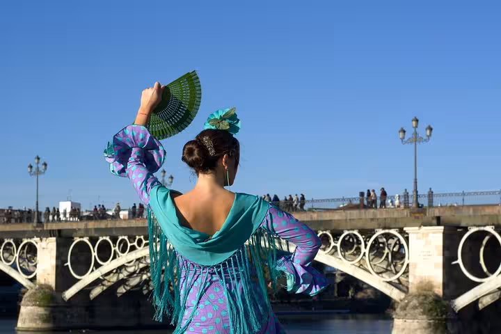 Experience vibrant Spanish culture with a flamenco dancer by the iconic Triana Bridge in Seville, Andalusia tour.